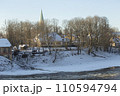 Winter city landscapes of Kuldiga, Latvia. Ancient buildings through a pattern of trees. High quality photo 110594794