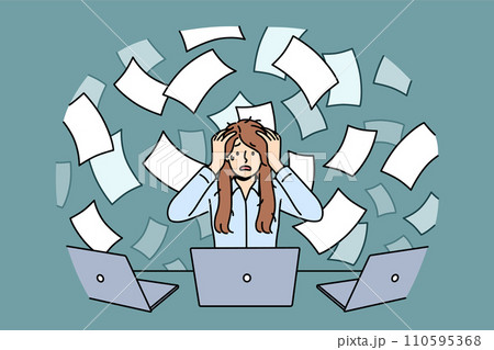 Overworked woman suffers from overload and clutches head sitting at table, among flying documents 110595368
