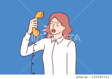 Aggressive woman secretary screams into telephone, arguing with clients or partners 110595512
