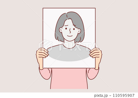 Anonymous woman hides face behind banner with fake portrait to remain incognito and leave no traces 110595907