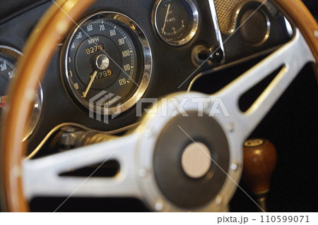 Steering wheel of vintage car at an antique car exhibition in Denmark Steering wheel of vintage car at an antique car exhibition in Denmark 110599071