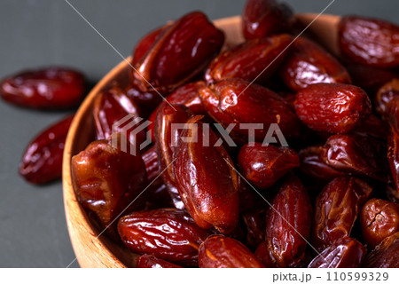 fruits dates. dried dates in a wood pot fruits dates. dried dates in a wood pot 110599329