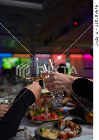 Clinking glasses with alcohol and toasting, party. Clinking glasses with alcohol and toasting, party. 110599646