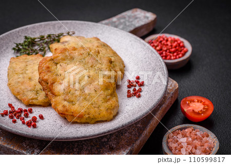 Delicious juicy fried chicken or pork pancakes with salt, spices and herbs Delicious juicy fried chicken or pork pancakes with salt, spices and herbs 110599817