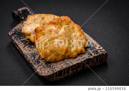 Delicious juicy fried chicken or pork pancakes with salt, spices and herbs 110599838