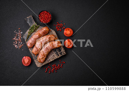 Delicious juicy grilled chicken or pork sausages with salt, spices and herbs Delicious juicy grilled chicken or pork sausages with salt, spices and herbs 110599888