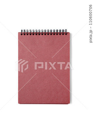 Open spiral bound notepad with craft red sheets, isolated on white background. Open spiral bound notepad with craft red sheets, isolated on white background. 110600706