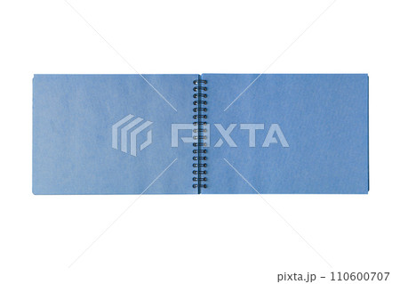 Open spiral bound notepad with craft blue sheets, isolated on white background. Open spiral bound notepad with craft blue sheets, isolated on white background. 110600707