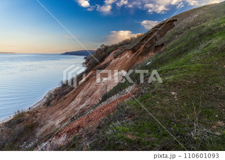 Stony, pebble and clay banks of the Volga River. Mountain slope of various stone rocks. Beautiful spring landscape view from above. Tetyushi, Tatarstan. 110601093