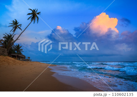 Sunset on tropical beach 110602135