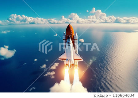 Aerial view of rocket launch at sunrise over ocean coast 110604034