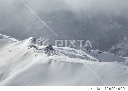 Winter high mountains in clouds 110604066