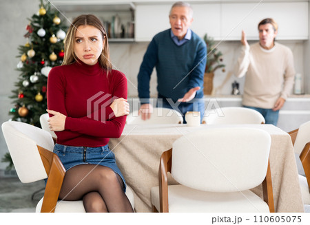 Men quarreling with girl 110605075