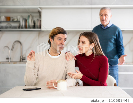 Old man quarreling with couple 110605442
