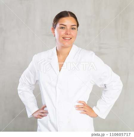 Young woman posing in medical uniform in studio Young woman posing in medical uniform in studio 110605717