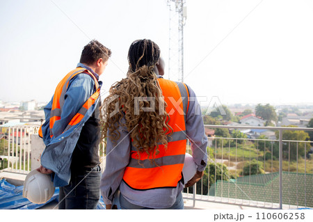 Team young engineer man and woman examining and checking station telecommunication. 110606258