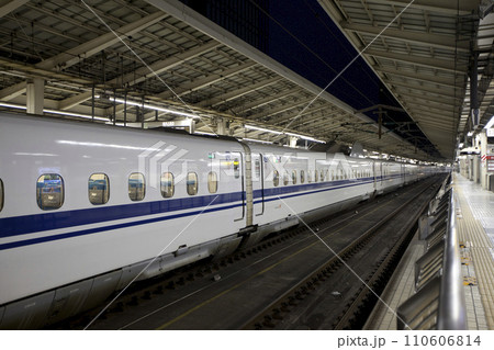 TOKYO - NOV 10,2013: Shinkansen bullet train at Tokyo railway station in November 10,2013 Tokyo, Japan. Shinkansen is world's busiest high-speed railway operated by four Japan Railways companies. TOKYO - NOV 10,2013: Shinkansen bullet train at Tokyo railway station in November 10,2013 Tokyo, Japan. Shinkansen is world's busiest high-speed railway operated by four Japan Railways companies. 110606814