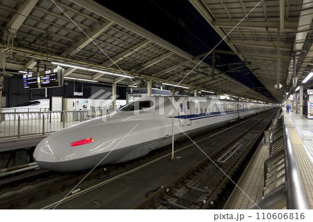 TOKYO - NOV 10,2013: Shinkansen bullet train at Tokyo railway station in November 10,2013 Tokyo, Japan. Shinkansen is world's busiest high-speed railway operated by four Japan Railways companies. TOKYO - NOV 10,2013: Shinkansen bullet train at Tokyo railway station in November 10,2013 Tokyo, Japan. Shinkansen is world's busiest high-speed railway operated by four Japan Railways companies. 110606816