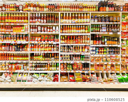 Many seasoning and sauces are on the shelves 110608525
