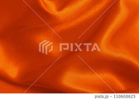 Orange fabric cloth texture for background and design art work, beautiful crumpled pattern of silk or linen. 110608625