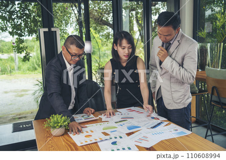 Happy business people meeting present graph chart investment, business data in meeting room. Group of business people meeting in conference room. Asian businessman speech, present teamwork partnership Happy business people meeting present graph chart investment, business data in meeting room. Group of business people meeting in conference room. Asian businessman speech, present teamwork partnership 110608994