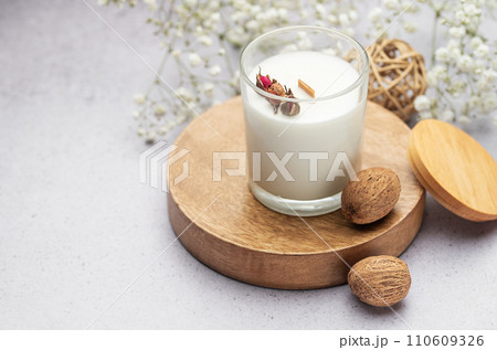 Aromatic candle on the table. 110609326