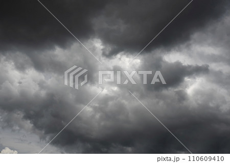 Dramatic dark storm thundercloud rain clouds on black sky background. Dark thunderstorm clouds rainny landscape. Meteorology danger windstorm disaster climate. Dark cloudscape storm disaster gray sky Dramatic dark storm thundercloud rain clouds on black sky background. Dark thunderstorm clouds rainny landscape. Meteorology danger windstorm disaster climate. Dark cloudscape storm disaster gray sky 110609410