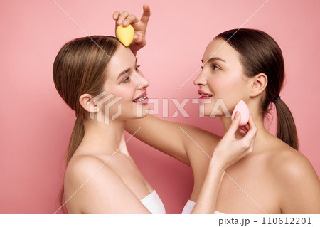 Makeup-Free Affirmation. Young girls stand united without makeup and uplifting each other through simple joy of applying makeup together. Makeup-Free Affirmation. Young girls stand united without makeup and uplifting each other through simple joy of applying makeup together. 110612201