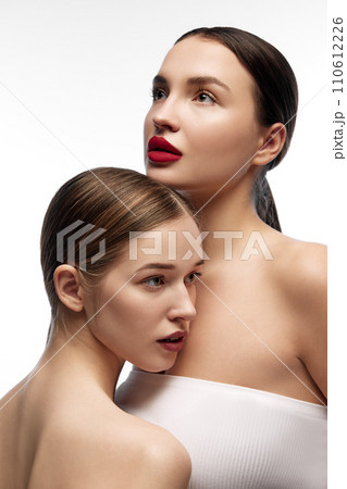 Diverse girls looking away, posing, showing their appearance. Holistic approach to health and well-being through clear skin and natural beauty. 110612226