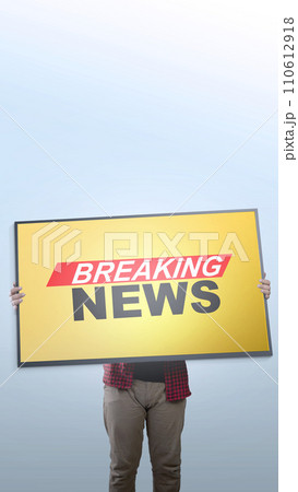 People carrying big screen televisions with breaking news inscriptions People carrying big screen televisions with breaking news inscriptions 110612918