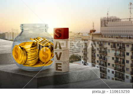 Golden dollar coin-filled glass jars with wooden cubes with save text 110613250