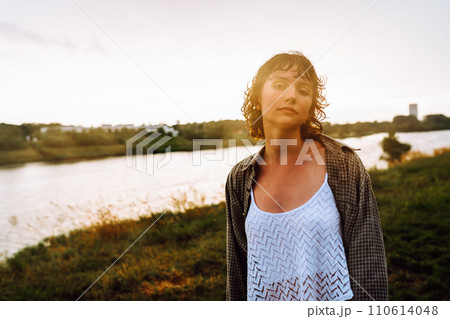 Portrait of happy teenage girl dancing barefoot after rain Portrait of happy teenage girl dancing barefoot after rain 110614048