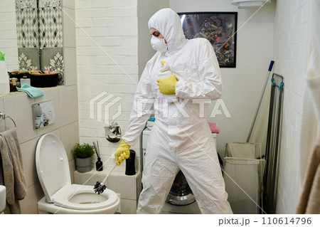 Guy with brush and bottle of detergent Guy with brush and bottle of detergent 110614796