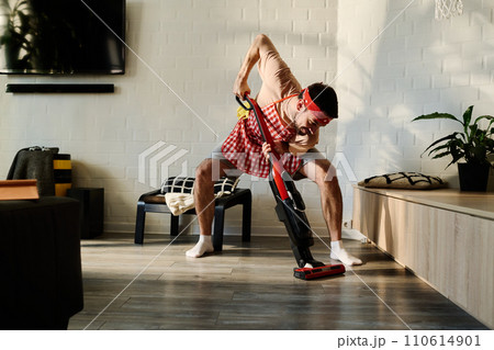 Cleaning floor of living room or bedroom Cleaning floor of living room or bedroom 110614901