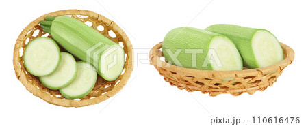 zucchini or marrow in a wicker basket isolated on white background with full depth of field. Top view. Flat lay 110616476