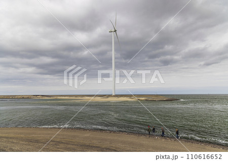 Wind turbines on edge of  national park Oosterschelde, Domburg - Vrouwenpolder, The Netherlands 110616652