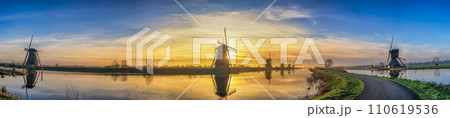 Rotterdam Netherlands, sunrise panorama nature landscape of Dutch Windmill at Kinderdijk Village Rotterdam Netherlands, sunrise panorama nature landscape of Dutch Windmill at Kinderdijk Village 110619536