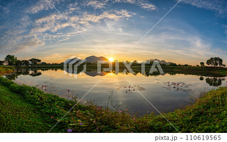 Tropical forest nature landscape with mountain range and pond water sunrise at Mae Moh mine, Lampang Thailand panorama Tropical forest nature landscape with mountain range and pond water sunrise at Mae Moh mine, Lampang Thailand panorama 110619565