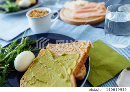 healthy breakfast toast with guacamole 110619936