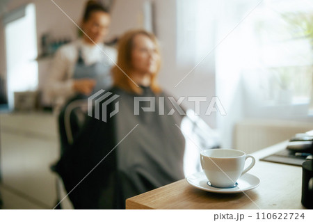 Closeup on cup of hot beverage in hair salon 110622724