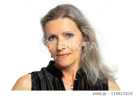 Beautiful grey-haired 50s woman looking at camera isolated on white.  110623818