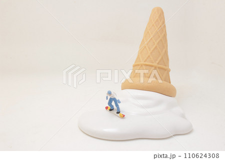 snowboarder with white icing on an ice cream cone. snowboarder with white icing on an ice cream cone. 110624308
