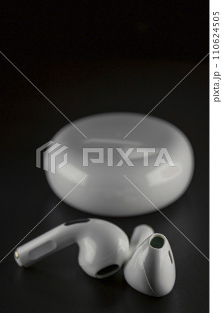 ROSTOV-ON-DON, RUSSIA - APRIL 28, 2018: Apple AirPods wireless Bluetooth headphones and charging case for Apple iPhone. New Apple Earpods Airpods in box. 110624505