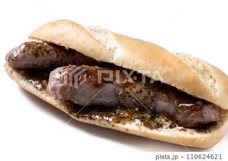 Traditional choripan, Argentina sandwich with chorizo and chimichurri sauce. isolated on white background Traditional choripan, Argentina sandwich with chorizo and chimichurri sauce. isolated on white background 110624621
