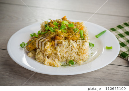 cooked bulgur with meat sauce and vegetables in a plate cooked bulgur with meat sauce and vegetables in a plate 110625100