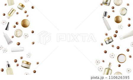 Skin care or beauty products bottles, macadamia nuts, cotton flowers isolated on white vertically seamless background flat lay view with copy space 110626395