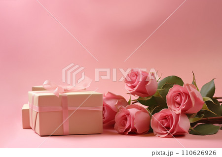 Beautiful pink rose flowers and present. Romantic gift wallpaper with space for text. Light gentle pink color bouquet garden rose photo poster border Beautiful pink rose flowers and present. Romantic gift wallpaper with space for text. Light gentle pink color bouquet garden rose photo poster border 110626926