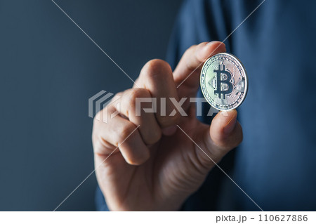 Bitcoin Blockchain Technology and Cryptocurrency. Hand holding bitcoin for Digital Finance and trading concept. Bitcoin Blockchain Technology and Cryptocurrency. Hand holding bitcoin for Digital Finance and trading concept. 110627886