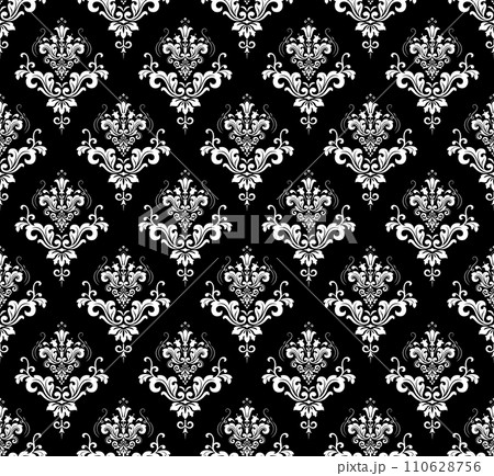 Wallpaper in the style of Baroque. Seamless vector background. White and black floral ornament. Graphic pattern for fabric, wallpaper, packaging. Ornate Damask flower ornament 110628756