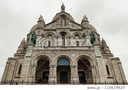The main entrance of the Roman Catholic church Sacre Coeur Basilica in Montmartre. The main entrance of the Roman Catholic church Sacre Coeur Basilica in Montmartre. 110629920